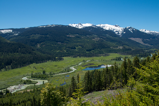 The Soo river surrounded mountains, forms a serpentine in the marshland of the valley in beautiful British Columbia, Canada. The valley is accessible by forest service roads (dirt roads).