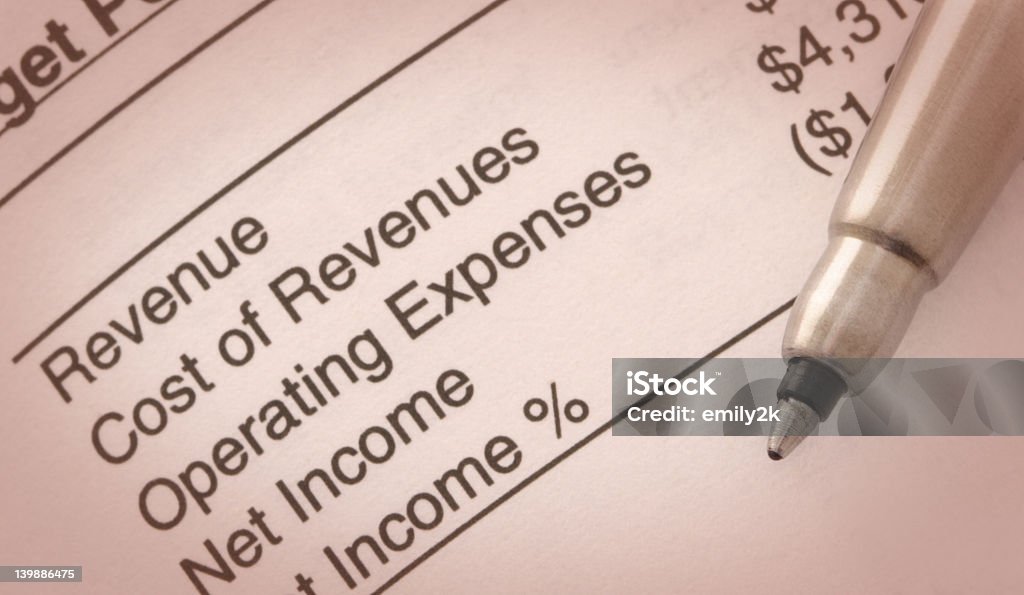 Pen on Target Performance Income Summary Still-life of Pen on  Income Summary Analyzing Stock Photo