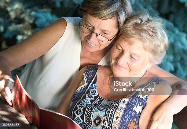 Reading Together Stock Photo - Download Image Now - Active Lifestyle, Active Seniors, Activity