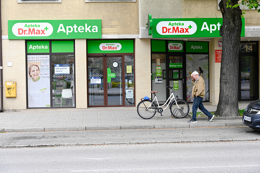 Świnoujście, Poland, May 11, 2022 - General view of the pharmacy Dr. Max at Plac Słowiańsk in Świnoujście, an unidentified stroller in the background
