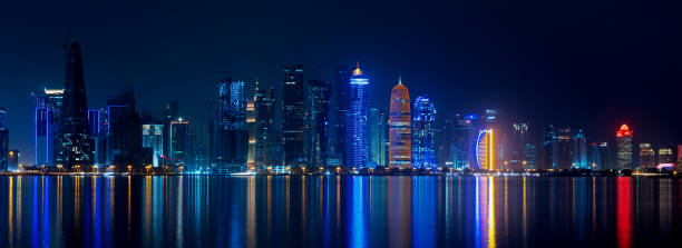 istock Doha skyline with many towers during the night. 1398868817