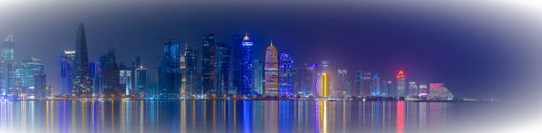 istock Doha skyline with many towers during the night. 1398868832