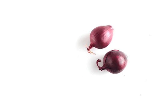 healthy eating concept - red onion isolated on white background flat lay. Image contains copy space