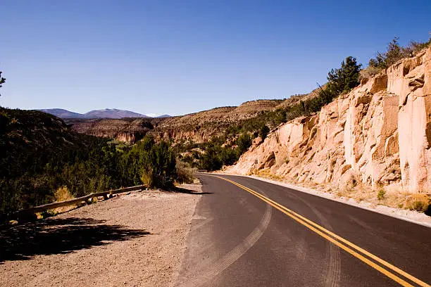 A shot looking along a road down into a valley.