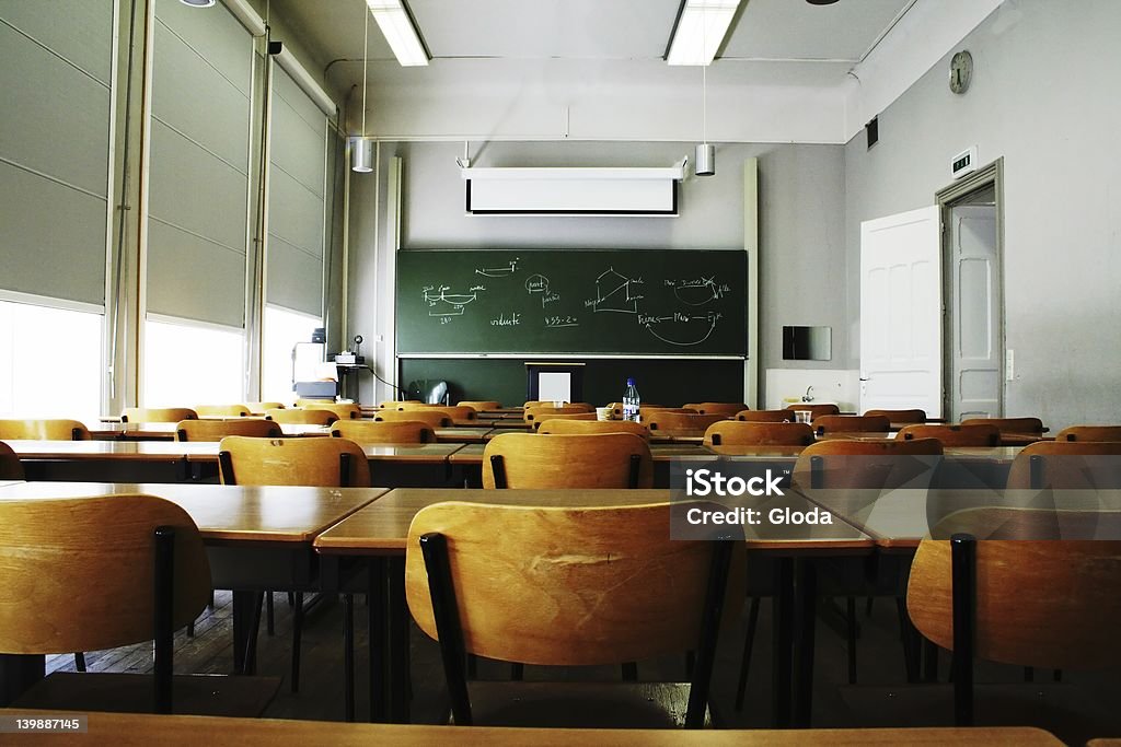 Empty Classroom A large, empty classroom, lit by morning light. Classroom Stock Photo