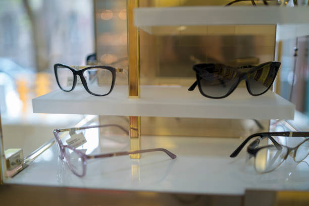 istock Glasses in an optician's shop sorted in a row on the shelf 1398873388