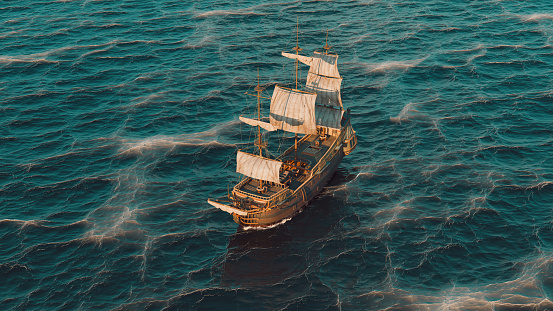 Old ship sails on the sea seen from aerial point of view