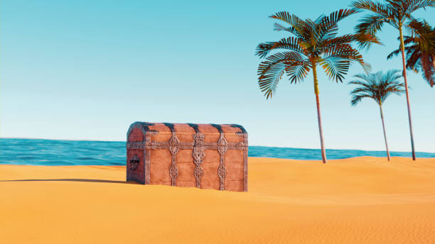 Treasure chest is left behind in the sand on an island stock photo