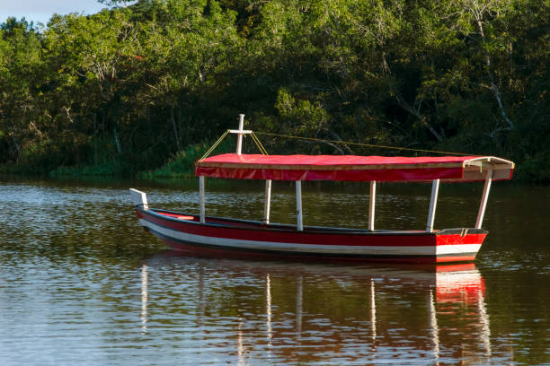 istock Boat stopped on the river against forest background. 1398876717