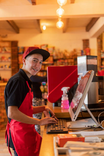 istock An 18-year-old Latino waiter from a small restaurant is on a restaurant computer taking orders 1398879435