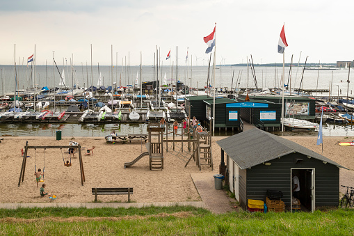 Muiderberg, The Netherlands, July 12, 2021; Small beach at the water sports center Muiderberg