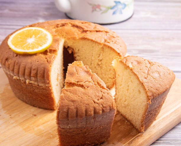 istock Sliced orange cake over wooden surface, selective focus. 1398879808