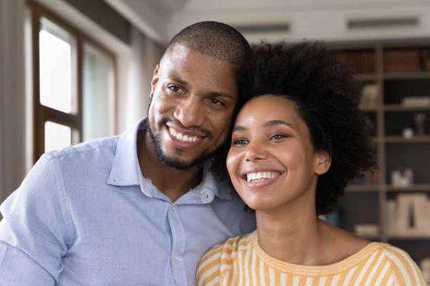 istock Handsome husband and beautiful wife smiling looking at camera 1398880165