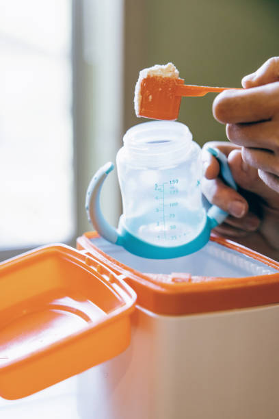 istock Baby Formula Being Scooped Into Milk Bottle 1398880999