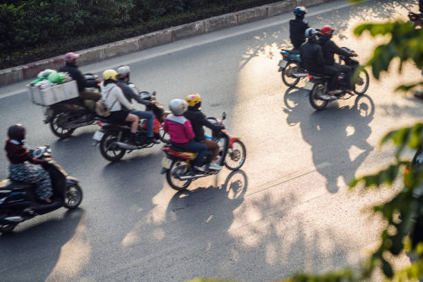 istock Motor scooters at the highway blurred in motion, high angle view 1398881187
