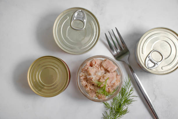 istock Canned fish, jar, dill on a light background tuna 1398881243