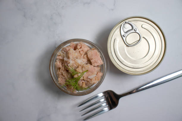 istock Canned fish, jar, dill on a light background tuna 1398881432