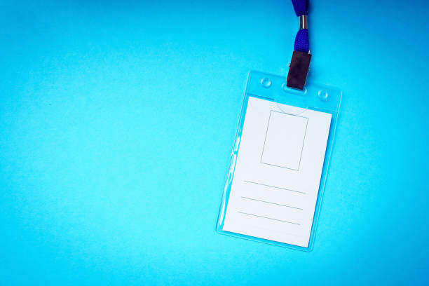 istock Blank empty badge on a blue background. Badge is a universal means of personal identification of a person. Medical theme concept. 1398882097