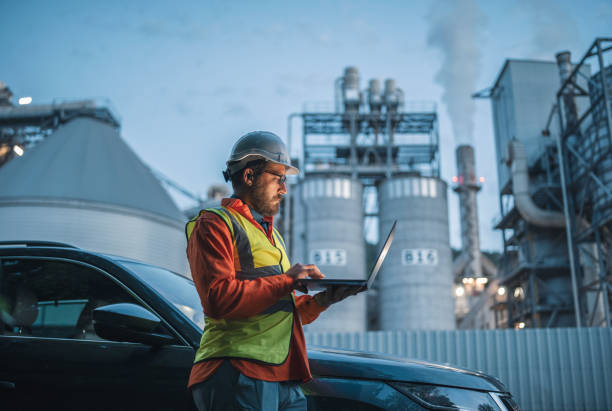 istock Hard working engineer on the power station with laptop. 1398884897