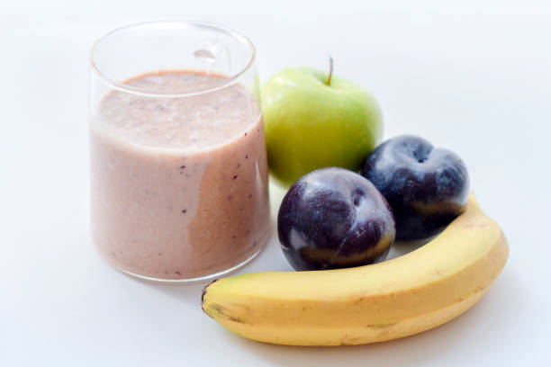 Banana, apple fruit and plum fruit smothie with yoghurt.