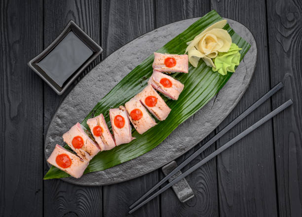 istock Sushi roll dragon with tuna and spicy sauce 1398886887