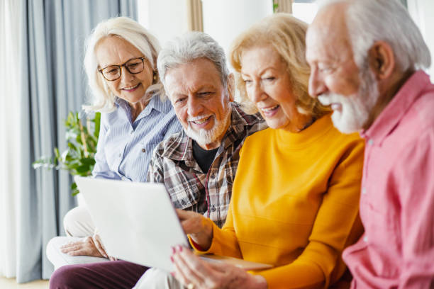 istock Seniors surfing the Net and smiling 1398889787