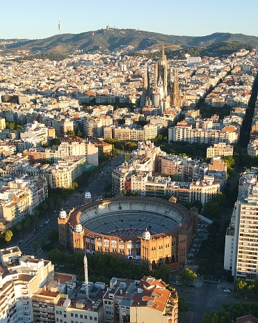 Drone shot of La Arenas de Barcelona and La Sagrada Familia, Barcelona, Spain