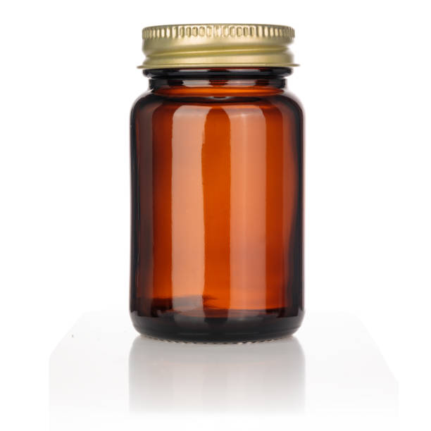 istock Empty brown glass bottle for supplements, vitamins and a gold cap. 1398896302