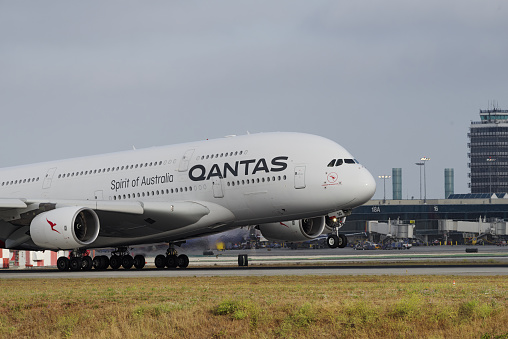 Los Angeles, California, USA - May 22, 2022: image of Qantas Airbus A380-842 with registration VH-OQD shown touching down at Los Angeles International Airport, LAX. Fergus McMaster livery.