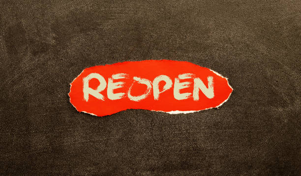 istock torn paper revealing the word REOPENING on white background 1398896616