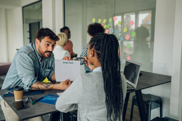 istock Two multiracial colleagues having a meeting in the office 1398900797