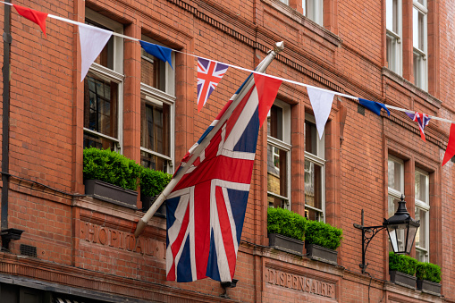 British Flag over the old French Dispensaire in Soho, London