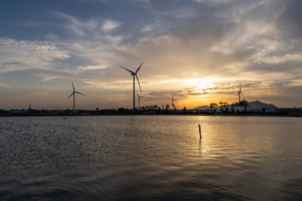 istock Wind turbines on the beach at dusk 1398902457
