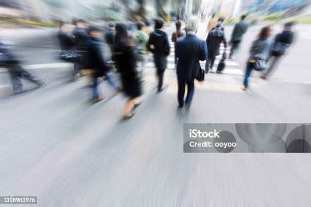 Tokyo City Commuters At Crosswalk Stock Photo - Download Image Now - Blurred Motion, Businessman, Crosswalk