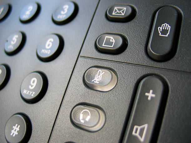 istock VoIP phone keypad with focus on mute button 139890430
