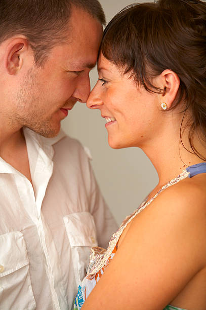 istock Sweet young couple looking at each other 139890436
