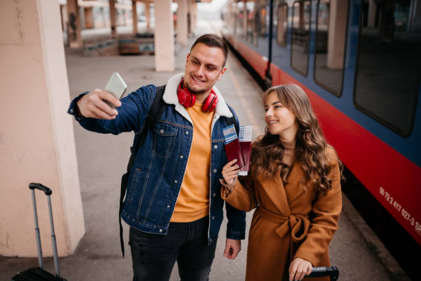 istock Couple at the train station and selfie 1398904948