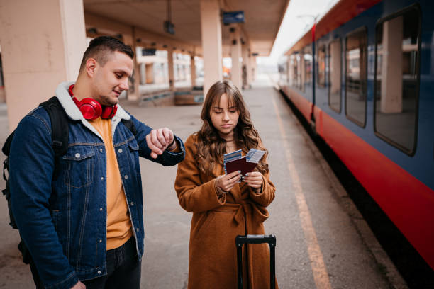 istock Long distance relationship, couple at train station 1398905072