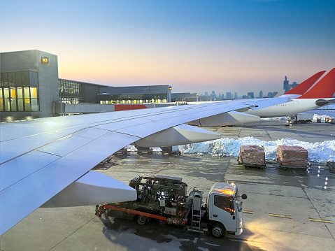 Loading commercial plane in an airport