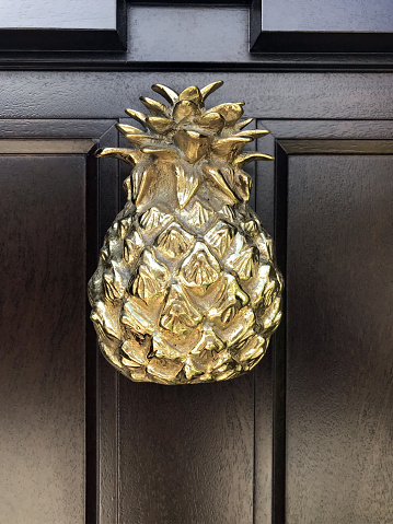 rustic doorknob with golden pineapple shape