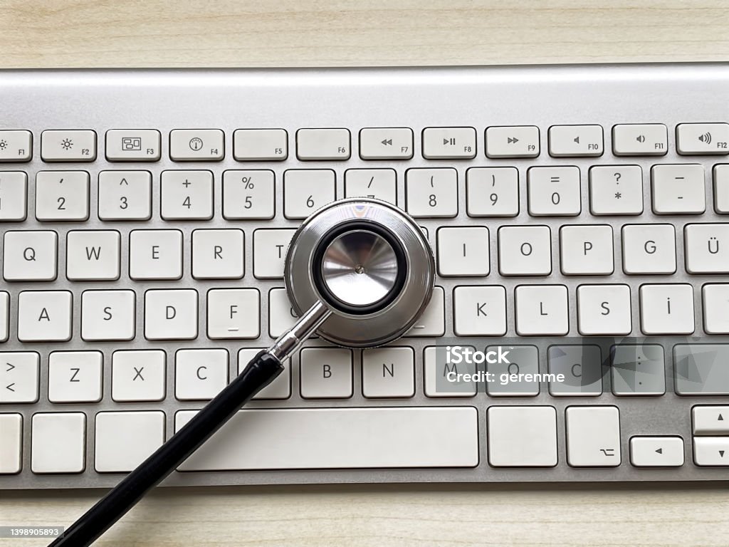 Computer diagnostics Stethoscope on a laptop symbolizing computer diagnostics Assistance Stock Photo