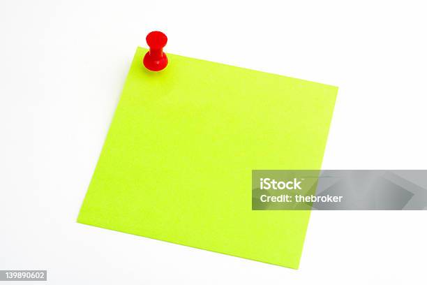 Isolated Green Paper With Red Pushnail On White Background Stock Photo - Download Image Now
