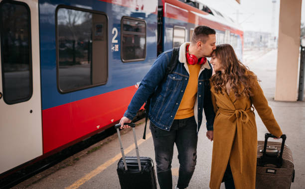 istock Long distance relationship, couple at train station 1398906834
