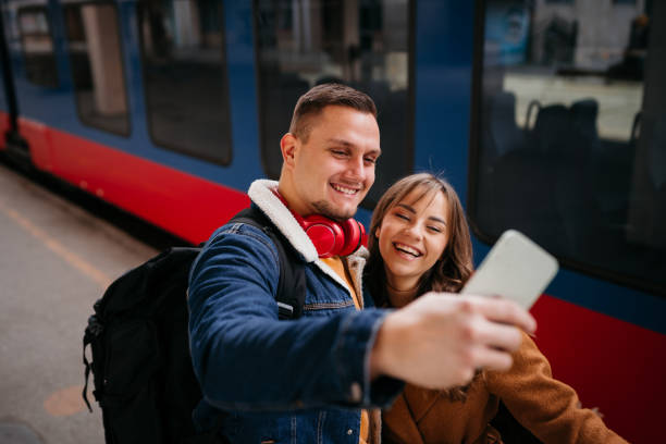 istock Couple at the train station and selfie 1398908382