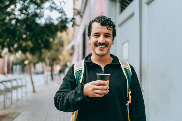 Man with takeaway coffee Man with takeaway coffee in Santiago, Chile chilean ethnicity stock pictures, royalty-free photos & images