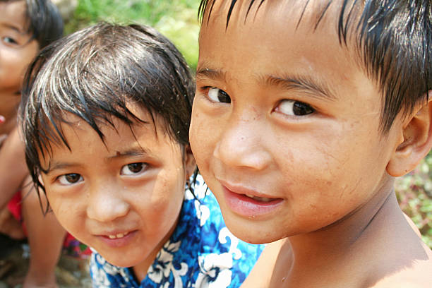 istock Two ethic children playing in the water in a hot day 139891236