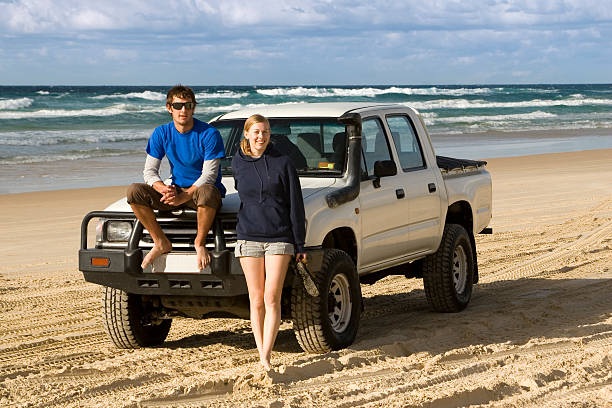 Backpackers 4WDing on Australia's Fraser Island stock photo