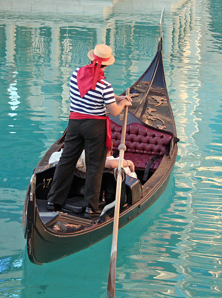 istock Traditional gondolier in blue water 139891437
