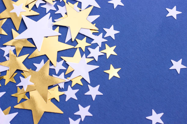 istock Stars glitter on blue background, selective focus. Festive holiday backdrop 1398920563