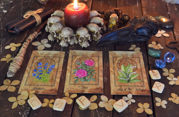 istock Wicca, esoteric and occult still life with vintage magic objects and tarot cards on witch table altar for mystic rituals and fortune telling. Halloween and gothic concept 1398923414